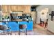 Bright kitchen with wood cabinets, stainless appliances, Saltillo tile floors and a breakfast bar at 36721 N 17Th Ave, Phoenix, AZ 85086