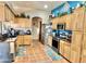 Spacious kitchen with stainless appliances, ample cabinet space, and Saltillo tile floors at 36721 N 17Th Ave, Phoenix, AZ 85086