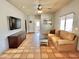 Bright living room with comfortable seating, terra cotta flooring, and stylish decor at 36721 N 17Th Ave, Phoenix, AZ 85086