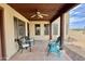 Relaxing covered patio with tile flooring, ceiling fan, offering an inviting outdoor living space at 36721 N 17Th Ave, Phoenix, AZ 85086