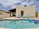 Enjoy the backyard pool area, featuring Adirondack chairs and covered patio at 36721 N 17Th Ave, Phoenix, AZ 85086