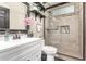 Bathroom with glass shower, vanity, and tiled floors for a sleek and modern experience at 4243 E Jasper Dr, Gilbert, AZ 85296
