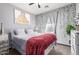 Bedroom featuring a soft color palette, natural light, and charming decorative vines for a tranquil setting at 4243 E Jasper Dr, Gilbert, AZ 85296