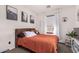 Cozy bedroom featuring a double bed with decorative pillows, carpeted floor, and natural light from a window at 4243 E Jasper Dr, Gilbert, AZ 85296