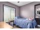 Bedroom with blue bedding, carpet, and a large window for natural light at 4243 E Jasper Dr, Gilbert, AZ 85296