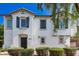 Charming two-story home featuring a stucco exterior, decorative shutters, and a tile roof at 4243 E Jasper Dr, Gilbert, AZ 85296