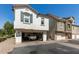 Home exterior showing a two story facade with open garage featuring a Range Rover parked inside at 4243 E Jasper Dr, Gilbert, AZ 85296