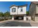 Facade of a two story home with open garage, and a driveway at 4243 E Jasper Dr, Gilbert, AZ 85296