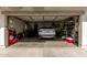 Garage with a Range Rover parked, and ample storage solutions creating an organized space at 4243 E Jasper Dr, Gilbert, AZ 85296