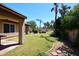 Lush backyard featuring a well-maintained lawn, mature trees, and beautiful landscaping at 4609 E Monte Cristo Ave, Phoenix, AZ 85032