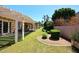 Landscaped backyard with a covered patio and well-manicured lawn, perfect for outdoor entertaining at 4609 E Monte Cristo Ave, Phoenix, AZ 85032