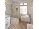 Elegant bathroom featuring a glass-enclosed shower, tiled walls, and modern fixtures at 4609 E Monte Cristo Ave, Phoenix, AZ 85032