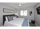 Cozy bedroom featuring a comfortable bed, a window with blinds, and a ceiling fan at 4609 E Monte Cristo Ave, Phoenix, AZ 85032