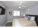Comfortable bedroom with a ceiling fan, window with blinds, and neutral wall color at 4609 E Monte Cristo Ave, Phoenix, AZ 85032