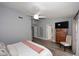 Well-lit bedroom with wood floors, a ceiling fan, and a closet for storage at 4609 E Monte Cristo Ave, Phoenix, AZ 85032