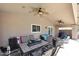 Inviting covered patio with ample seating, a ceiling fan, and an outdoor dining area at 4609 E Monte Cristo Ave, Phoenix, AZ 85032