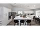 Updated kitchen featuring a large center island, stainless steel appliances, and stylish backsplash at 4609 E Monte Cristo Ave, Phoenix, AZ 85032