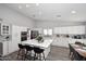 Modern kitchen features an island with bar seating, recessed lighting, and stainless steel appliances at 4609 E Monte Cristo Ave, Phoenix, AZ 85032