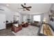 Bright living room featuring a ceiling fan, wood floors, neutral colors and comfortable seating at 4609 E Monte Cristo Ave, Phoenix, AZ 85032