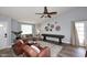 Inviting living room with comfortable seating, a ceiling fan, and stylish decor for cozy gatherings at 4609 E Monte Cristo Ave, Phoenix, AZ 85032