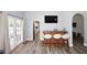 Entertaining space with a bar, hardwood floors, and access to the outdoor area through French doors at 4609 E Monte Cristo Ave, Phoenix, AZ 85032