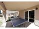 Spacious covered patio featuring a ping pong table, offering an ideal space for recreational activities at 4609 E Monte Cristo Ave, Phoenix, AZ 85032