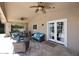 Inviting covered patio with ceiling fans and comfortable seating, perfect for outdoor relaxation and entertaining at 4609 E Monte Cristo Ave, Phoenix, AZ 85032