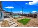 Landscaped backyard with a newly seeded lawn and pool area, offering outdoor enjoyment at 4828 N 71St Ave, Phoenix, AZ 85033