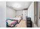 Bedroom featuring tiled floors, light gray walls, and a twin sized bed at 4828 N 71St Ave, Phoenix, AZ 85033