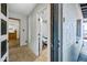 View from an entryway, showcasing an open doorway leading to the kitchen at 4828 N 71St Ave, Phoenix, AZ 85033