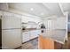 Bright kitchen featuring white cabinets, laminate counters, and stainless steel appliances at 4828 N 71St Ave, Phoenix, AZ 85033