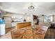 Bright open kitchen with white cabinets, stainless appliances, and breakfast bar seating at 4828 N 71St Ave, Phoenix, AZ 85033