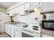 Bright kitchen featuring white cabinetry and stainless steel appliances at 4828 N 71St Ave, Phoenix, AZ 85033