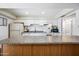 Well-lit kitchen with white cabinets, granite countertops, and matching appliances at 4828 N 71St Ave, Phoenix, AZ 85033