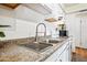 Close up of kitchen sink with white cabinets and counter space at 4828 N 71St Ave, Phoenix, AZ 85033