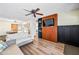 Open-concept living room with a ceiling fan and a view of the dining area and kitchen at 4828 N 71St Ave, Phoenix, AZ 85033