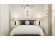 Cozy bedroom with a baseball theme, featuring complementary lamps and a warm ambiance at 4987 S 233Rd Dr, Buckeye, AZ 85326
