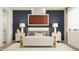 Stylish main bedroom featuring neutral tones, two bedside tables, and a large window for natural light at 4987 S 233Rd Dr, Buckeye, AZ 85326