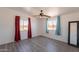 Bedroom featuring colorful curtains, ceiling fan, and new flooring at 54073 W Stallion Rd, Maricopa, AZ 85139