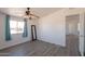 Bedroom featuring ceiling fan, new flooring, and a scenic view at 54073 W Stallion Rd, Maricopa, AZ 85139