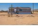Charming single-story home featuring a desert landscape and a well-maintained exterior at 54073 W Stallion Rd, Maricopa, AZ 85139