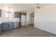 Modern kitchen features stainless steel appliances, sleek countertops, and gray cabinets at 54073 W Stallion Rd, Maricopa, AZ 85139