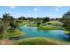 Picturesque aerial view of a scenic golf course with beautiful ponds and well-maintained landscaping at 633 Leisure World --, Mesa, AZ 85206