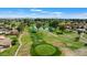 Stunning aerial view of a meticulously manicured golf course with a serene pond and surrounding neighborhood at 633 Leisure World --, Mesa, AZ 85206