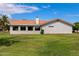 Charming single-story home with well-maintained lawn, red tile roof, and neutral-colored exterior at 633 Leisure World --, Mesa, AZ 85206