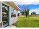 Backyard featuring lush green lawn and blue glass windows offering scenic golf course views at 633 Leisure World --, Mesa, AZ 85206