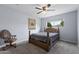Carpeted bedroom with a ceiling fan and a window showing a green outdoor view at 633 Leisure World --, Mesa, AZ 85206