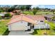 Aerial view of a well-maintained single-story home with a red tile roof and attached two-car garage at 633 Leisure World --, Mesa, AZ 85206