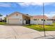 Charming single-story home with a two-car garage, red tile roof, gated front patio, and well-maintained landscaping at 633 Leisure World --, Mesa, AZ 85206