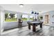 Spacious game room with a pool table and abundant natural light from large windows at 633 Leisure World --, Mesa, AZ 85206
